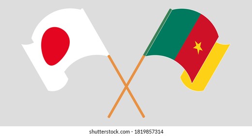 Crossed and waving flags of Cameroon and Japan