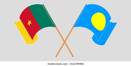 Crossed and waving flags of Cameroon and Palau. Vector illustration
