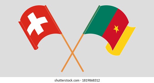 Crossed and waving flags of Cameroon and Switzerland