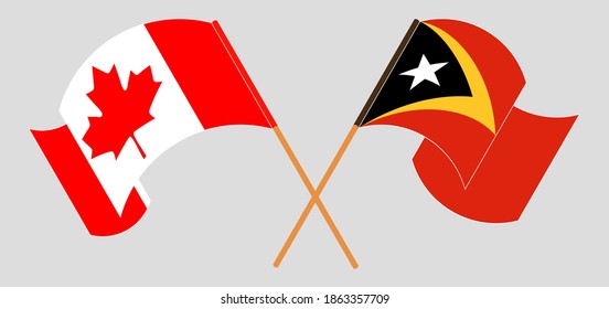 Crossed and waving flags of Canada and East Timor