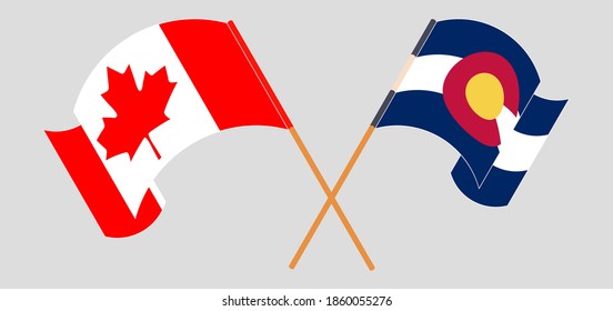 Banderas cruzadas y ondeando banderas de Canadá y el Estado de Colorado