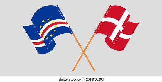 Crossed and waving flags of Cape Verde and Denmark