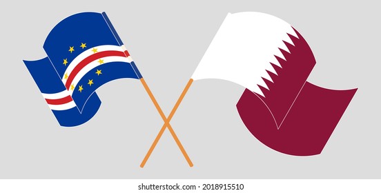 Crossed and waving flags of Cape Verde and Qatar