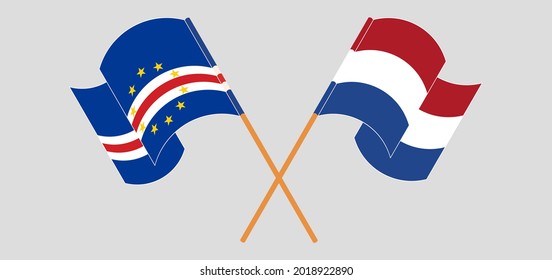 Crossed and waving flags of Cape Verde and the Netherlands