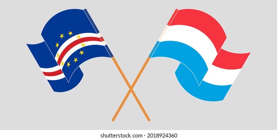 Crossed and waving flags of Cape Verde and Luxembourg