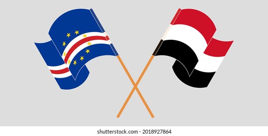 Crossed and waving flags of Cape Verde and Yemen