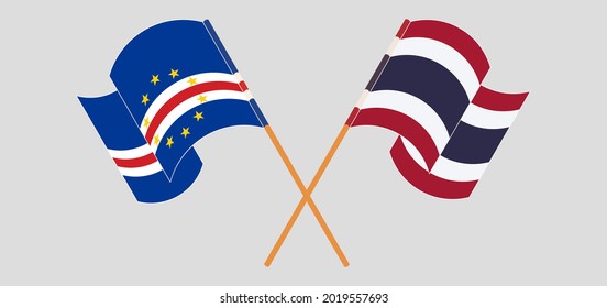 Crossed and waving flags of Cape Verde and Thailand