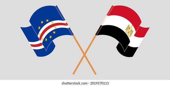 Crossed and waving flags of Cape Verde and Egypt