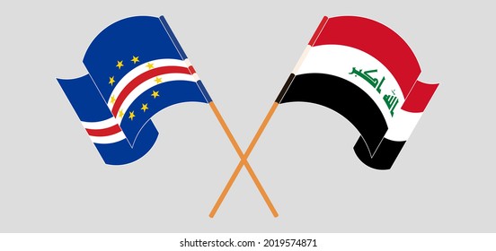 Crossed and waving flags of Cape Verde and Iraq