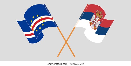 Crossed and waving flags of Cape Verde and Serbia