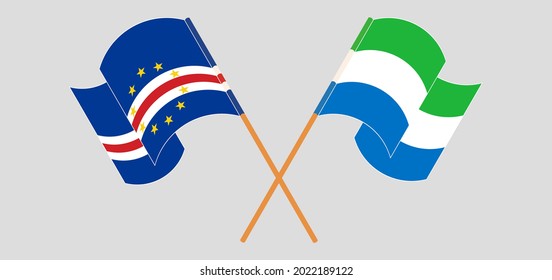 Crossed and waving flags of Cape Verde and Sierra Leone