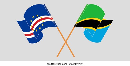 Crossed and waving flags of Cape Verde and Tanzania