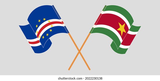 Crossed and waving flags of Cape Verde and Suriname