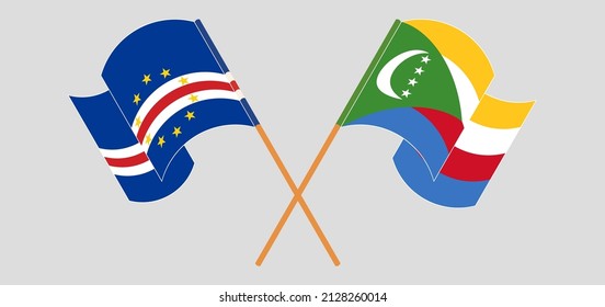 Crossed and waving flags of Cape Verde and Comoros. Vector illustration
