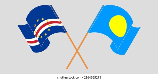 Crossed and waving flags of Cape Verde and Palau. Vector illustration
