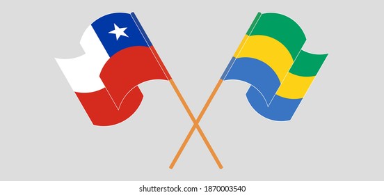 Crossed and waving flags of Chile and Gabon