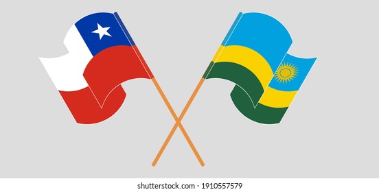 Crossed and waving flags of Chile and Rwanda