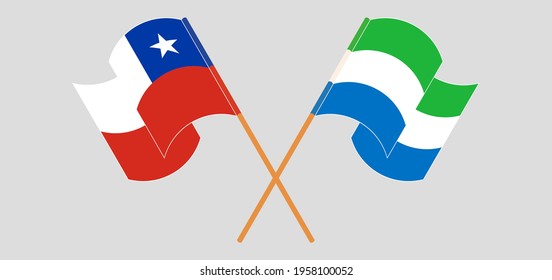 Crossed and waving flags of Chile and Sierra Leone