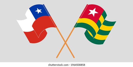 Crossed and waving flags of Chile and Togo