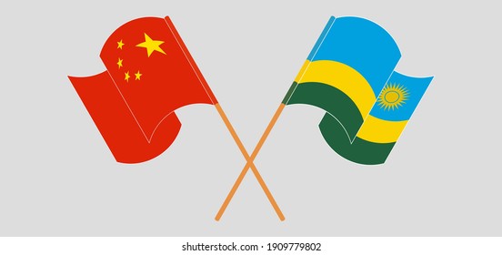 Crossed and waving flags of China and Rwanda