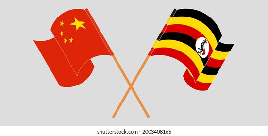 Crossed and waving flags of China and Uganda