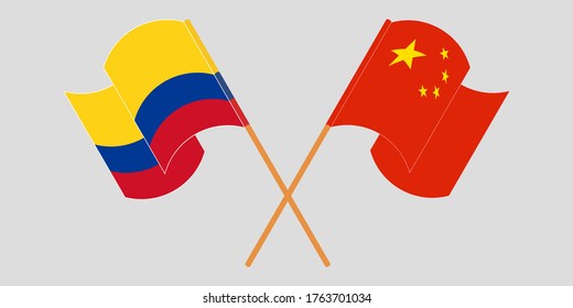 Banderas cruzadas y ondeando banderas de Colombia y China