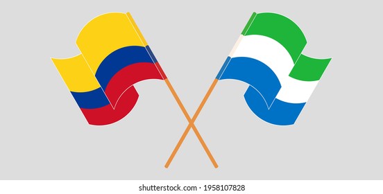 Crossed and waving flags of Colombia and Sierra Leone