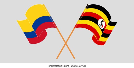 Banderas cruzadas y ondeando banderas de Colombia y Uganda
