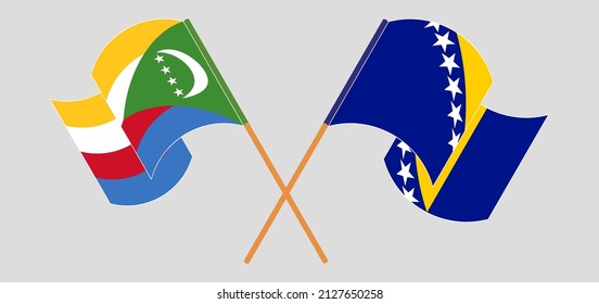 Crossed and waving flags of Comoros and Bosnia and Herzegovina. Vector illustration
