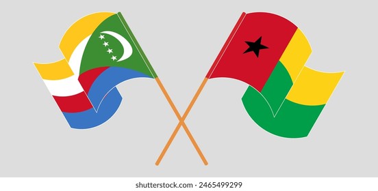 Crossed and waving flags of the Comoros and Guinea-Bissau. Vector illustration
