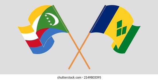 Crossed and waving flags of Comoros and Saint Vincent and the Grenadines. Vector illustration
