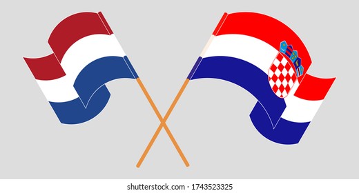 Crossed and waving flags of Croatia and the Netherlands