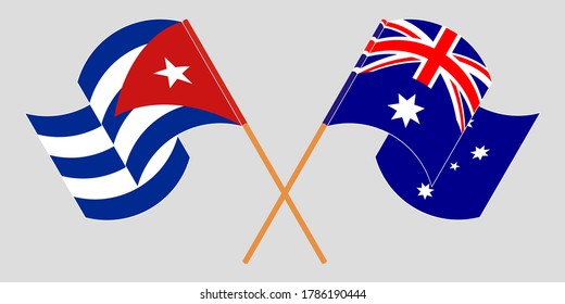 Crossed and waving flags of Cuba and Australia