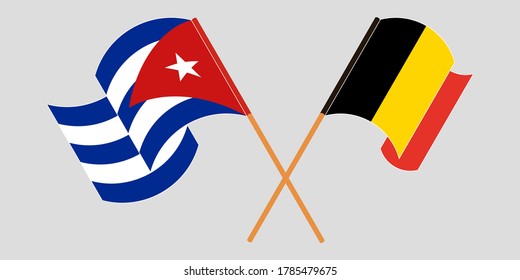 Crossed and waving flags of Cuba and Belgium