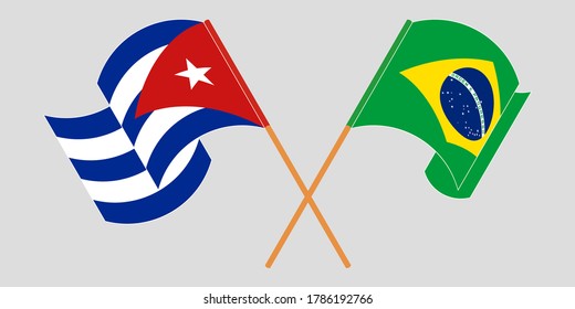 Crossed and waving flags of Cuba and Brazil