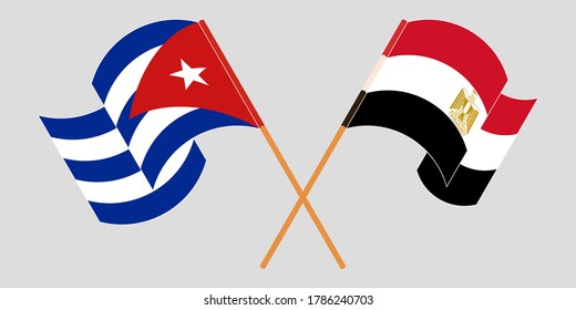 Crossed and waving flags of Cuba and Egypt
