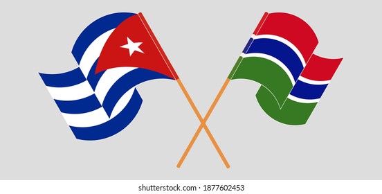 Crossed and waving flags of Cuba and the Gambia