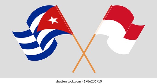 Crossed and waving flags of Cuba and Indonesia