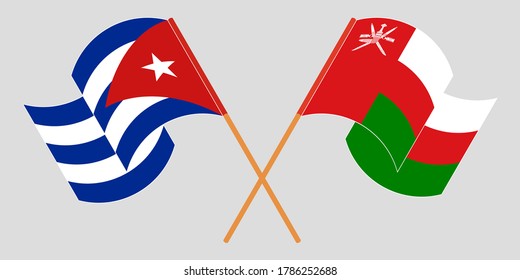 Crossed and waving flags of Cuba and Oman