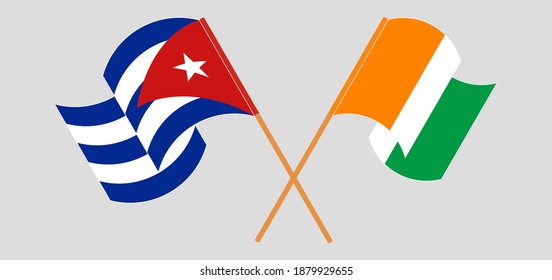 Crossed and waving flags of Cuba and Republic of Ivory Coast