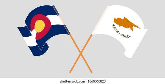 Crossed and waving flags of Cyprus and The State of Colorado