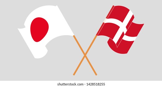 Crossed and waving flags of Denmark and Japan