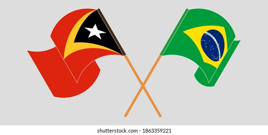 Banderas cruzadas y ondeando banderas de Timor Oriental y Brasil