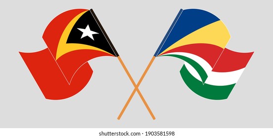 Crossed and waving flags of East Timor and Seychelles