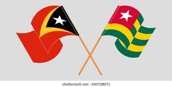 Crossed and waving flags of East Timor and Togo