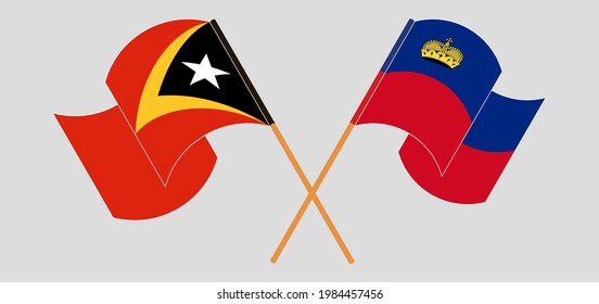 Crossed and waving flags of East Timor and Liechtenstein