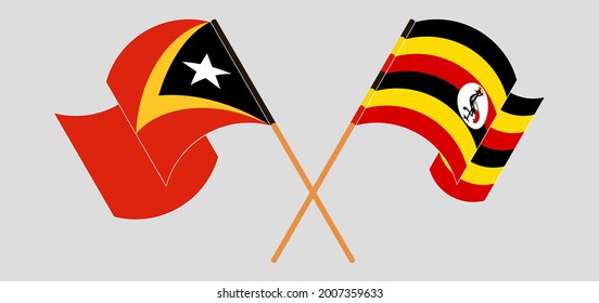 Banderas cruzadas y ondeando banderas de Timor Oriental y Uganda