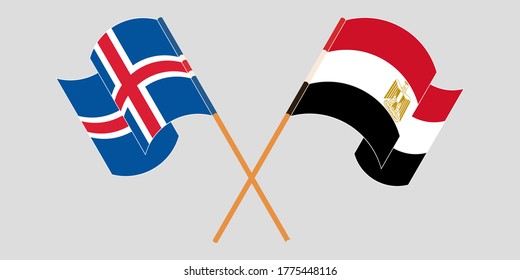 Crossed and waving flags of Egypt and Iceland