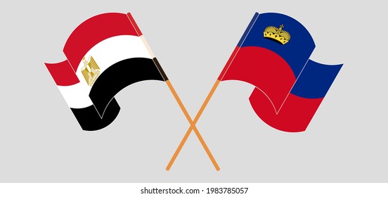 Crossed and waving flags of Egypt and Liechtenstein
