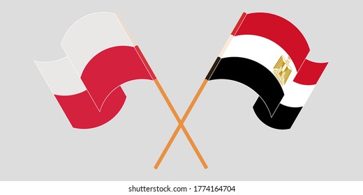 Crossed and waving flags of Egypt and Poland